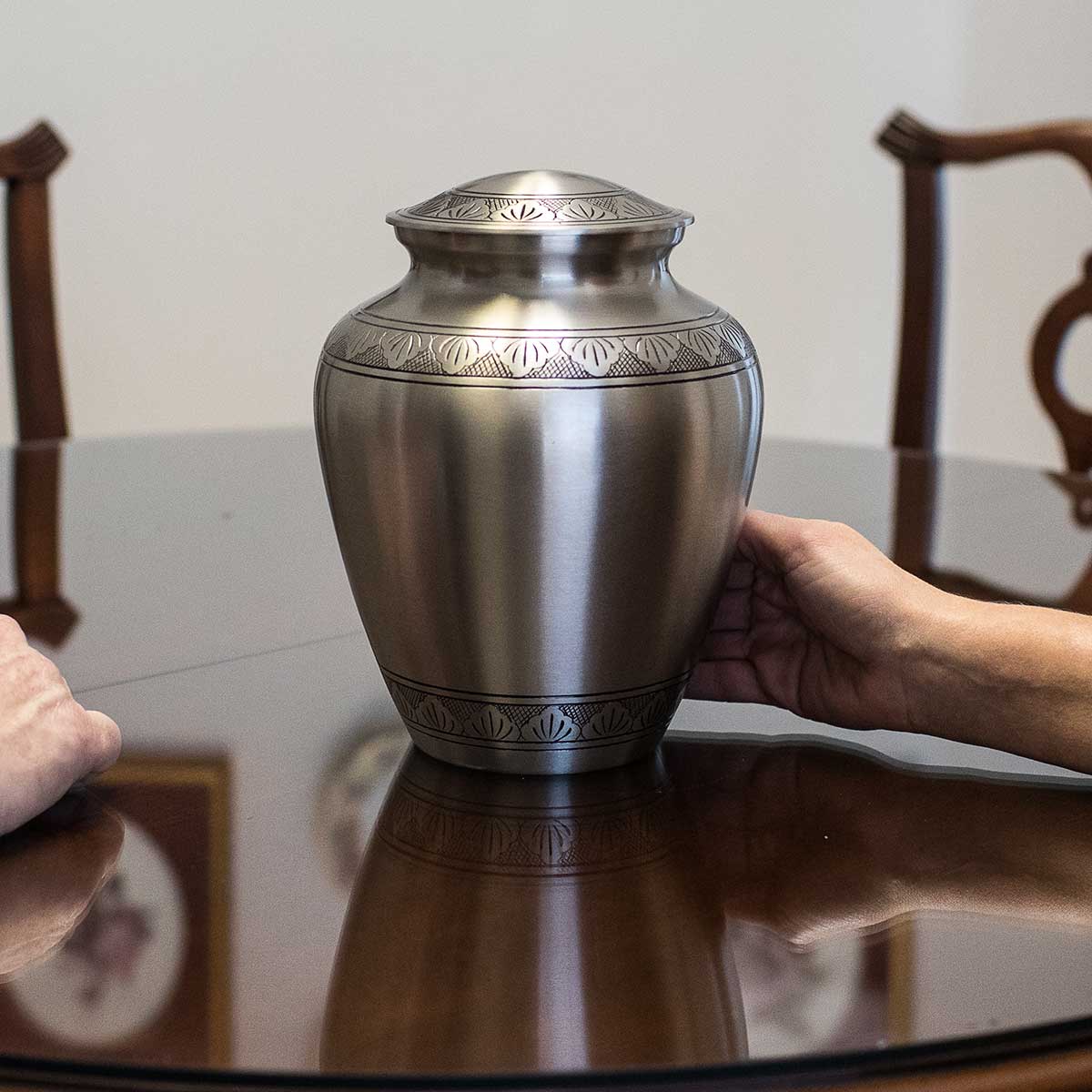 Silver urn funeral cremation options